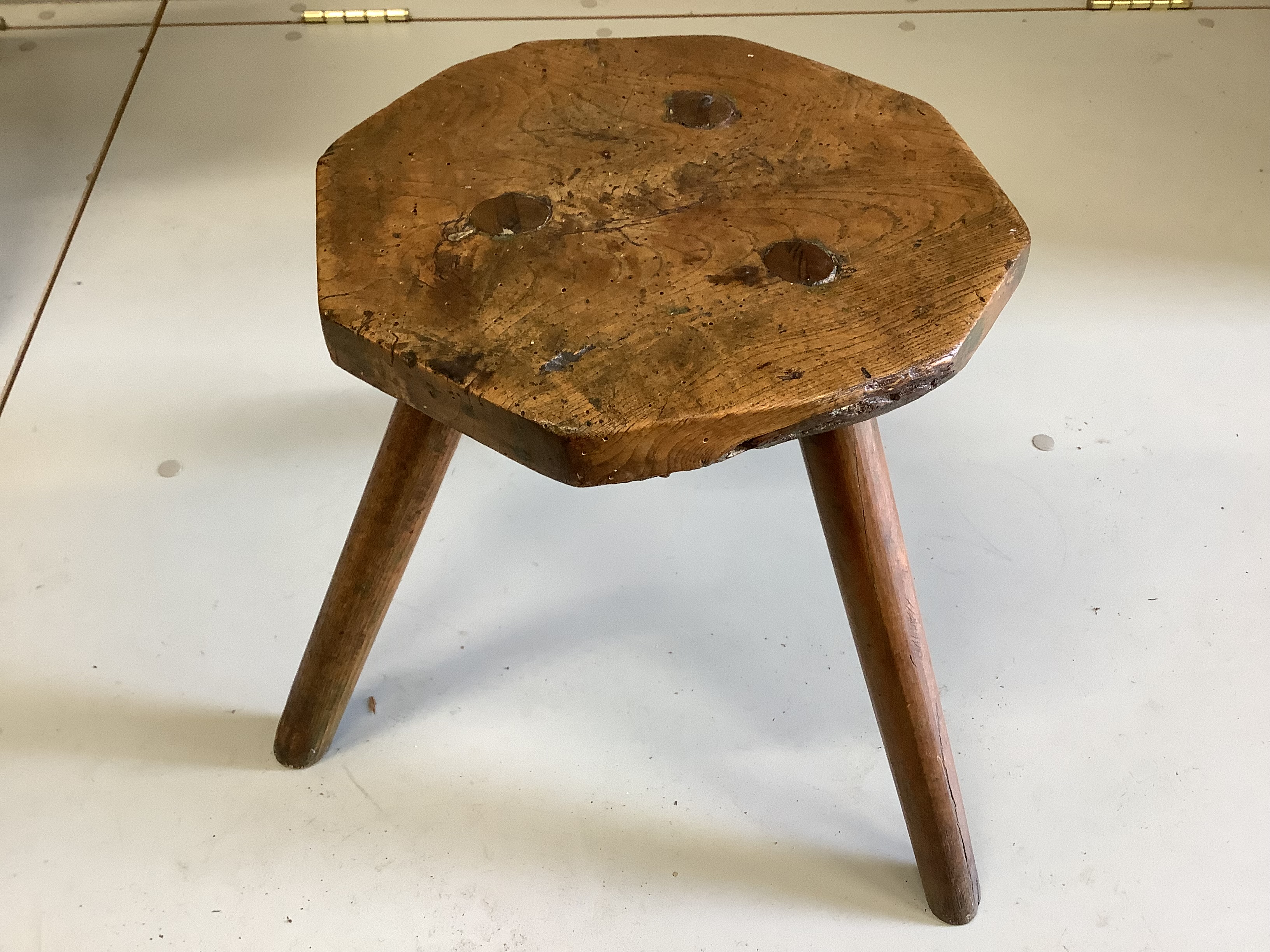 A 19th century pine and fruitwood bench and an elm hexagonal stool, bench length 172cm, height 46cm.